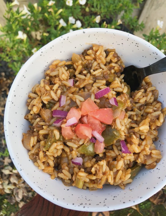 Easy Cajun Style Vegan Jambalaya Recipe (One Pot) - top view with tomatoes and onions topping