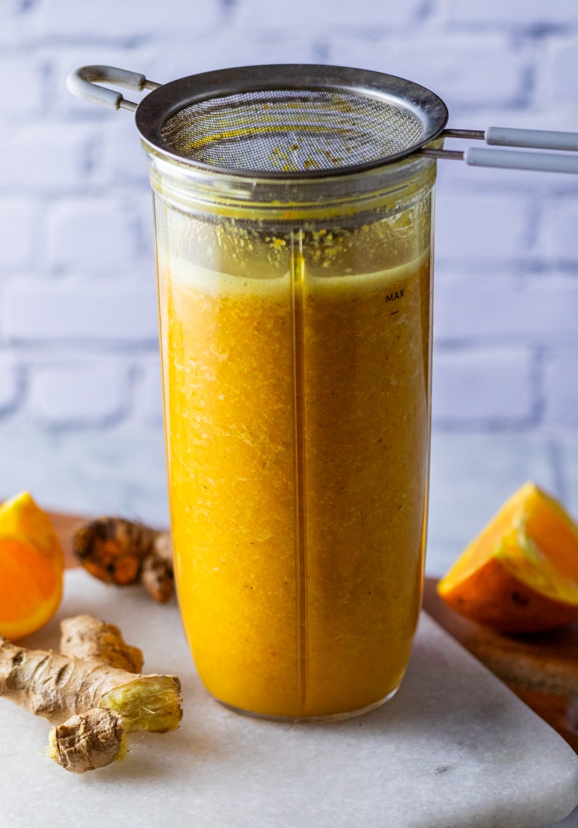 Lemon, Ginger & Turmeric Wellness Shot - showing side view of the blender cup with sieve